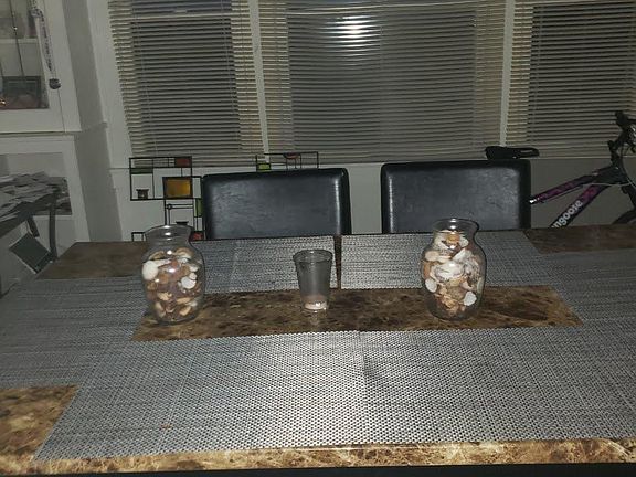 dining room with built in cabinets and each end of the large windows