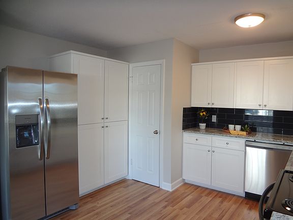 Kitchen view of double pantries