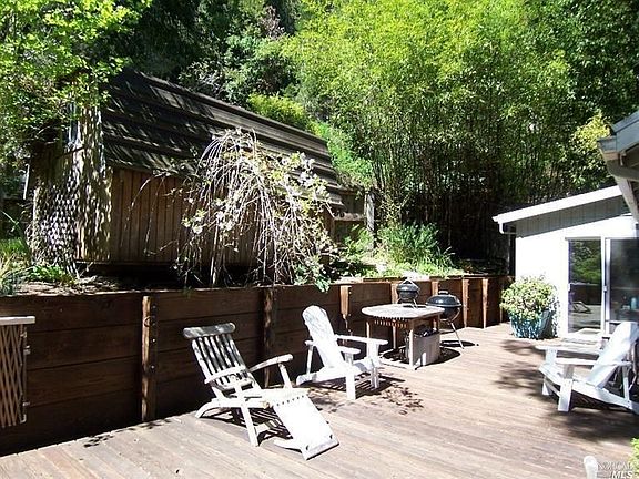 Large Storage Shed on hill. Slider leads to Kitchen.