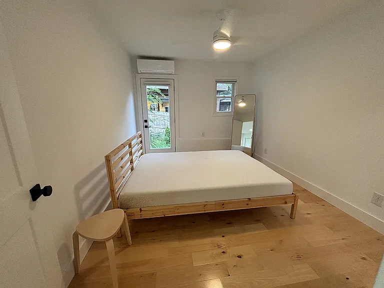 Bedroom with door to side garden