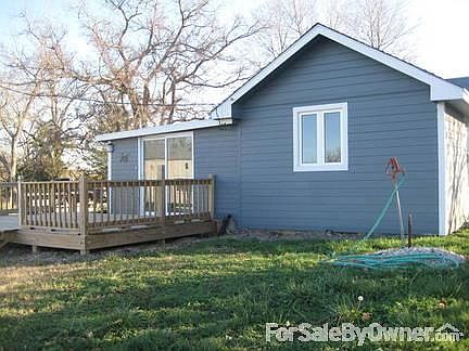 Back View off House
						:
						This Large window is over the kitchen sink at looks off to a field and timber.