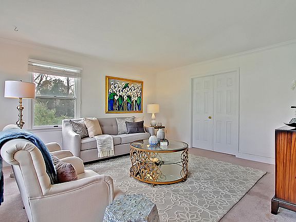 Living room opens to den