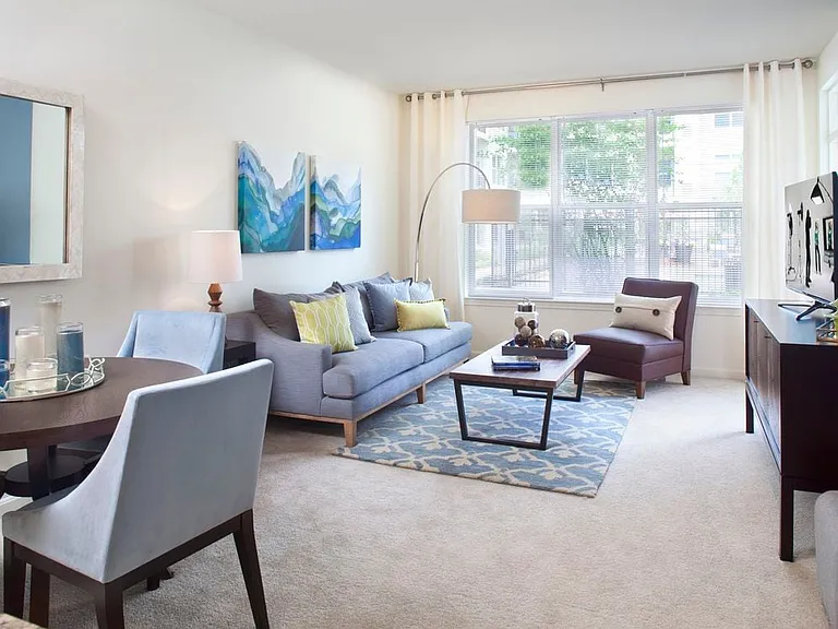 Classic Package living and dining room with carpet (hard surface flooring in select homes)
