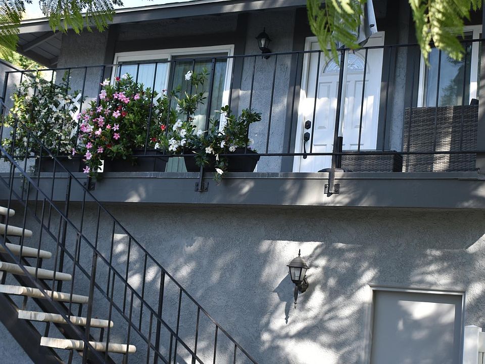 Stairway access to unit with garage entry below.
