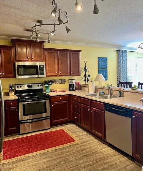 Fully equipped kitchen with stainless appliances.