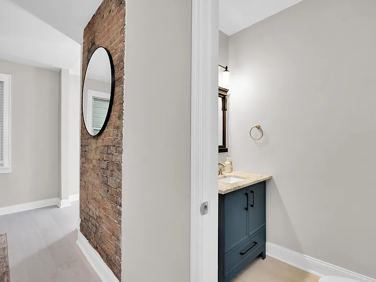 Bright, clean bathroom with essentials provided.