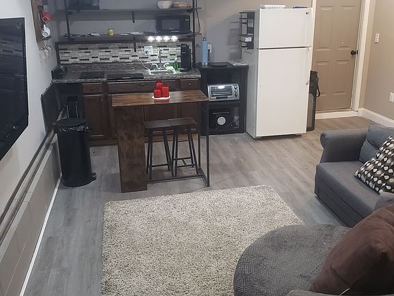 Open floor plan to include kitchenette and living space. Kitchen area has a flip up table for additional counter and work space as needed.
