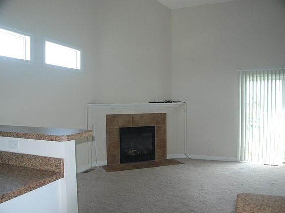 Great Room Fireplace looking from Kitchen