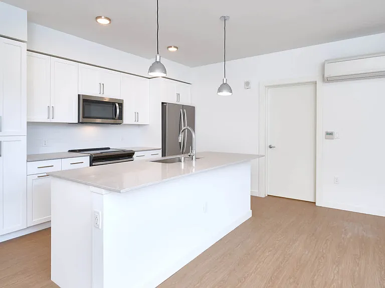 Kitchen with Quartz Countertops and Stainless Steel Appliances