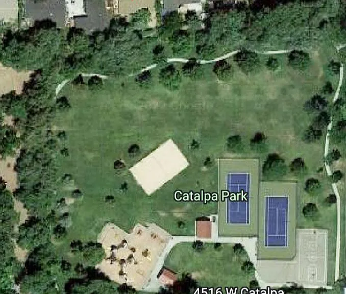 House backs up to Catalpa Park with a fence and stream separating the yard from the park.