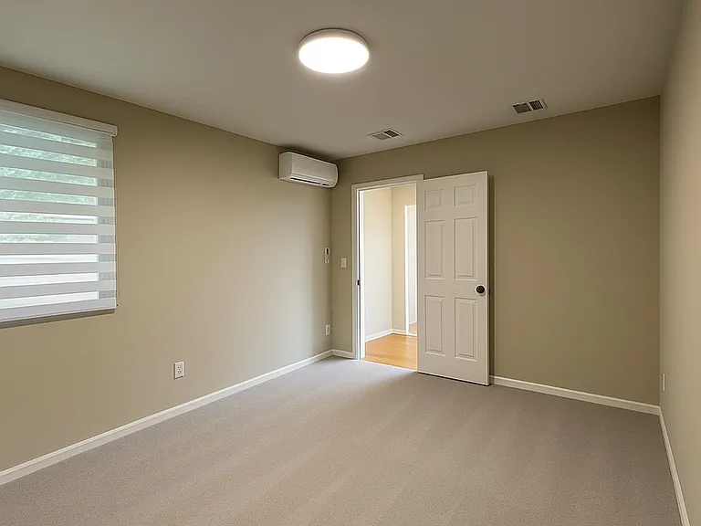 Bedroom with mini-split a/c and heat, Carpet has been removed for new LVP flooring throughout. New pics coming soon!