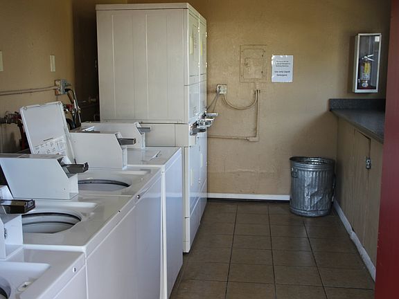 Community Laundry room under apartment livingroom