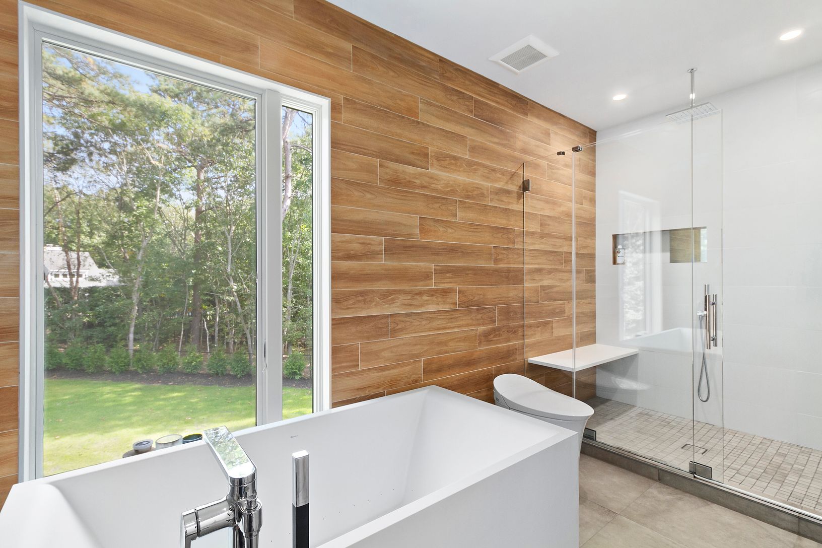 Primary bath with deep, jetted soaking tub, automatic commode.