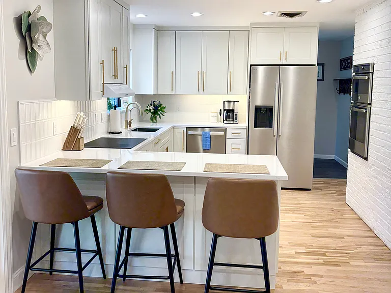 Induction stove top, in wall over and microwave, side by side refrigerator and freezer, under the sink water filtration system