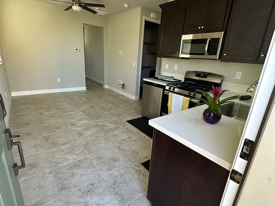 View from front door into kitchen and living room.