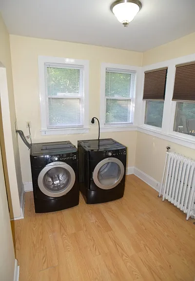 Laundry room and storage closet to left out of frame.