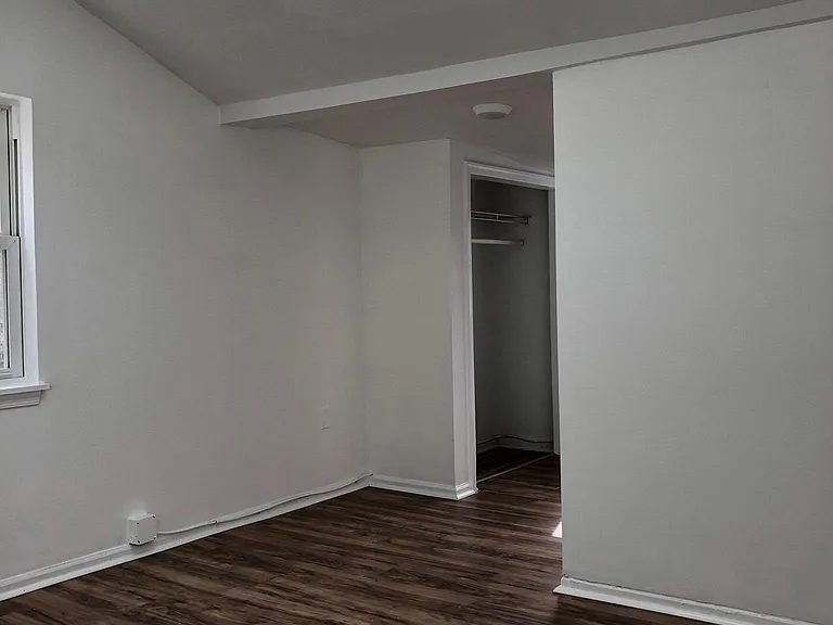 Master bedroom with en suite, vaulted ceiling, and sky light