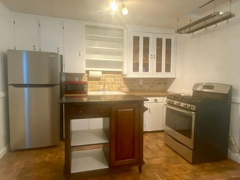 Stainless appliances and island