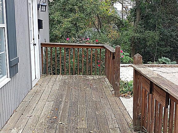 Relaxing front deck for patio furniture and plants.