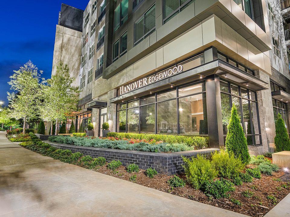 Elegant exterior of Hanover Edgewood showcasing modern design and lush landscaping in an urban setting.