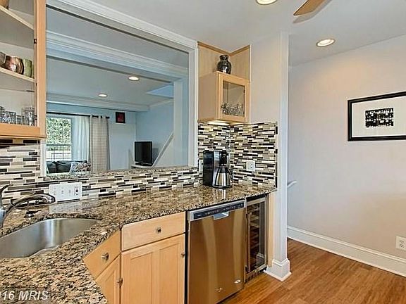 Kitchen with Serving/Social Window to Dining/Living Room