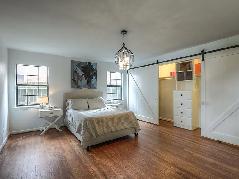 Primary bedroom en suite with a large closet and tv