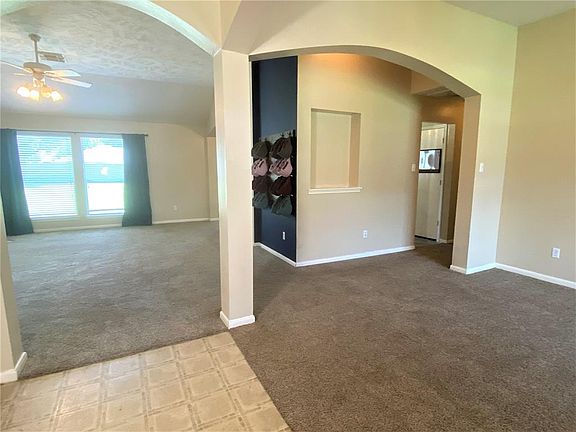 A view from the entry looking towards the family room and formal dining room, show how nicely the spaces flow.