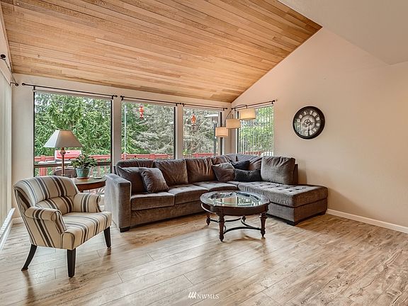 Formal living room with the touch of natural!  Big windows overlooking the wrap around deck>