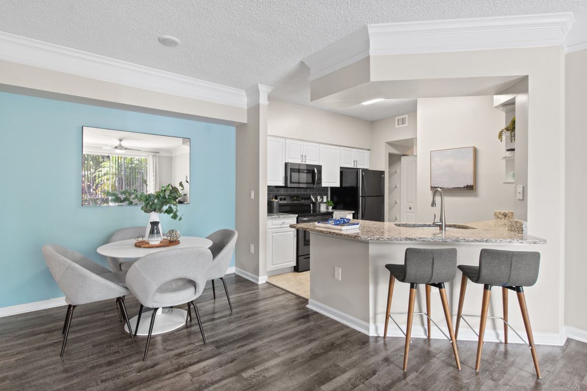 Kitchen and Dining Table at Verona at Boynton Beach Apartments in Boynton Beach, FL 33426