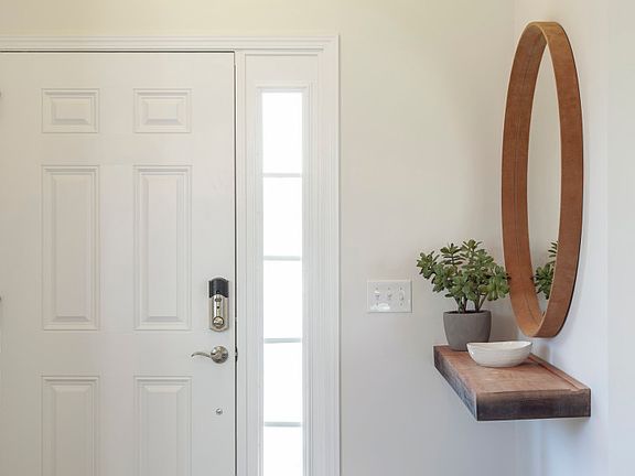 Welcome Guest with an open foyer and Coat Closet