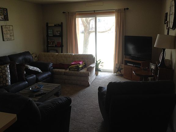 Living room opens to patio with lake view.