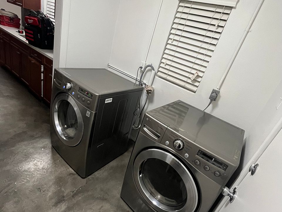 laundry room with washer and dryer