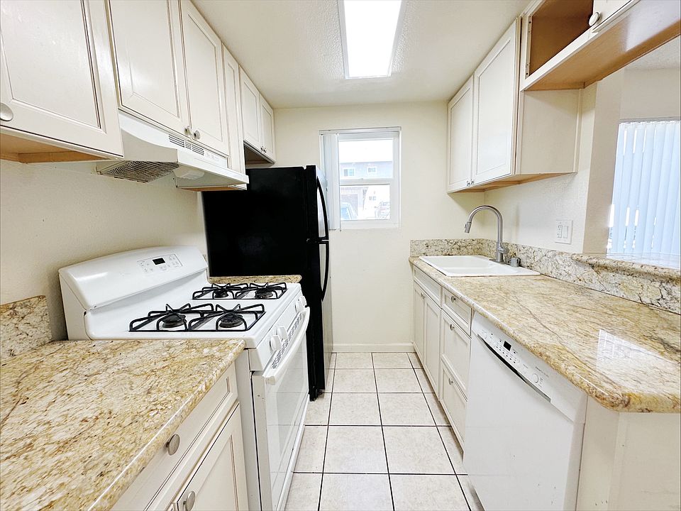 Bright kitchen includes a gas range stove, fridge/freezer and dishwasher!