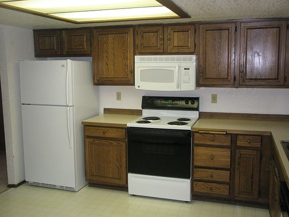 efficient kitchen with room for a table in addition to the f