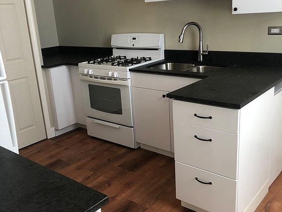 Laundry closet located in kitchen.