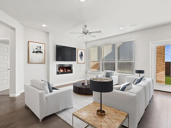 Living room in the Nobel home plan by Trophy Signature Homes - REPRESENTATIVE PHOTO