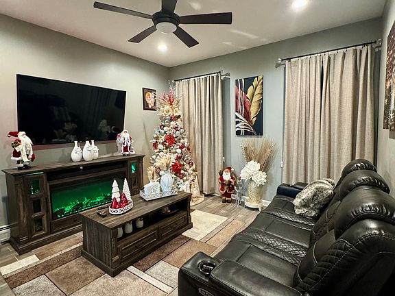 Spacious Living Room flooded with sunlight.
