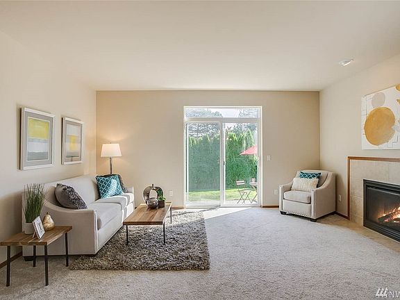 Cozy living room with gas fireplace makes it a pleasure to come home.