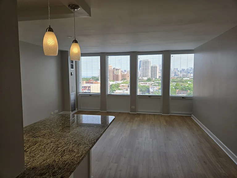 Living room with the eat-in kitchen in the foreground