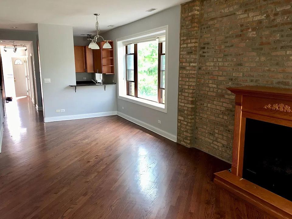 Open floor plan living/dining with view of kitchen