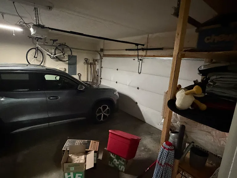 2 car garage with opener and shelving