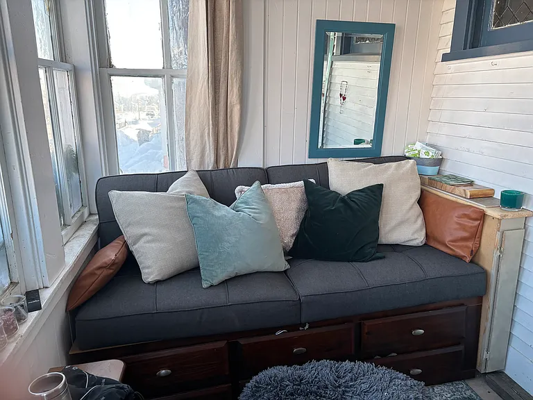 Enclosed front porch with futon couch/bed