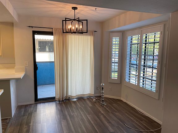 Dining area with view of the balcony.