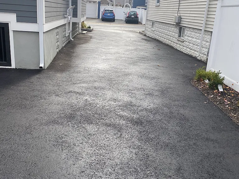 Paved driveway for parking or children activity.