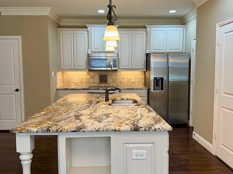 Kitchen with refrigerator included