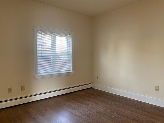 Living room with new luxury vinyl flooring and freshly painted.