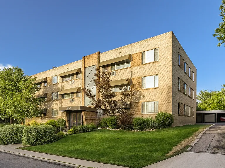 This classic apartment building offers a quiet, well-kept retreat with convenient covered parking just steps from the entrance.