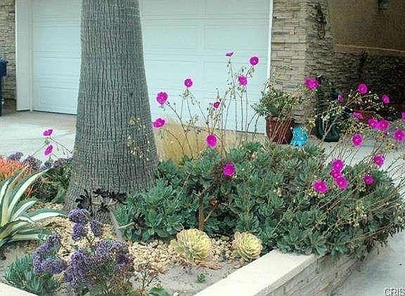 Planter box with entry way to front door on upper left.