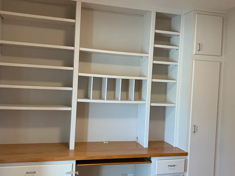 Front bedroom/office built in desk, bookshelves and cabinetry