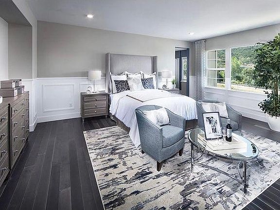 Large Master bedroom with hardwood flooring